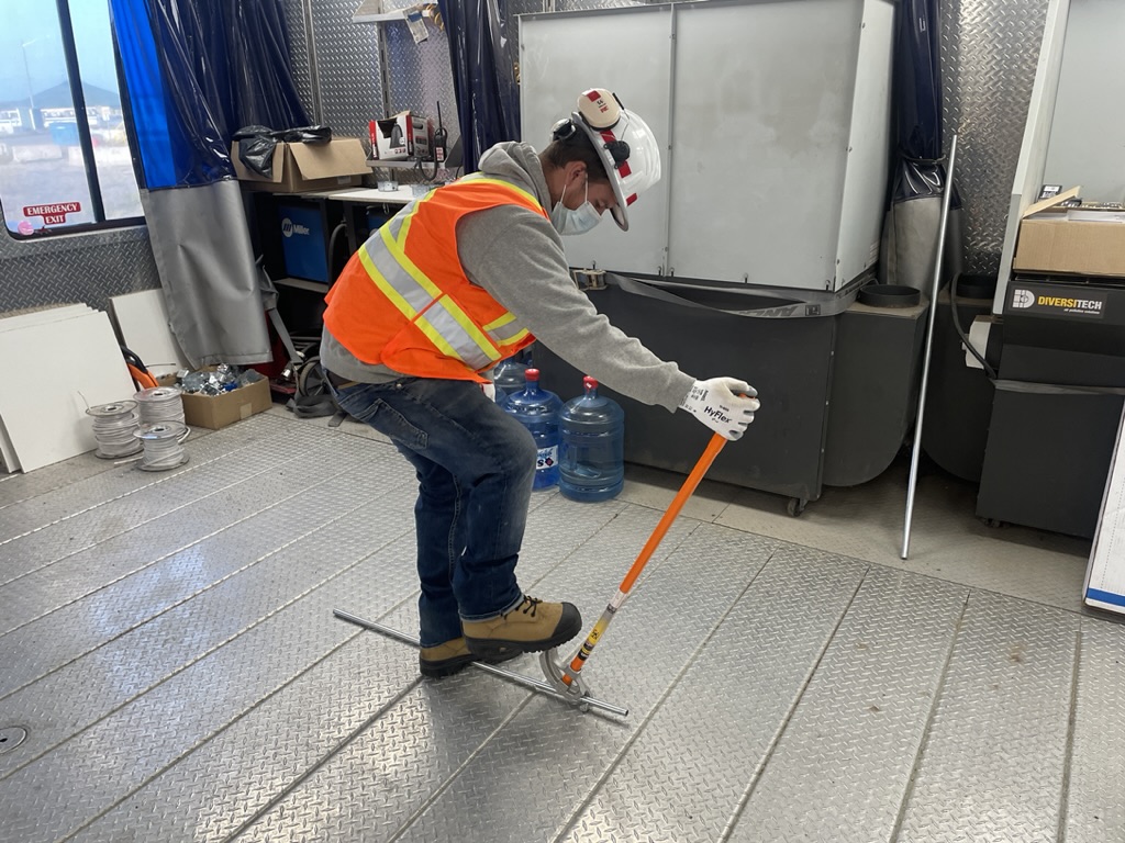 Electrical apprentice practising conduit bending during Level 1 training