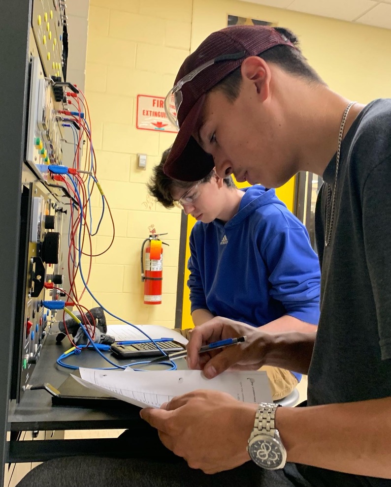 Try-a-Trade students applying electrical theory on a classroom training system