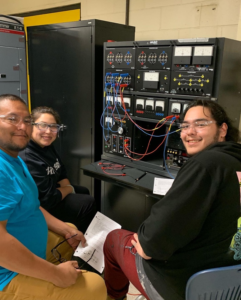Try-a-Trade students completing an electrical theory exercise together