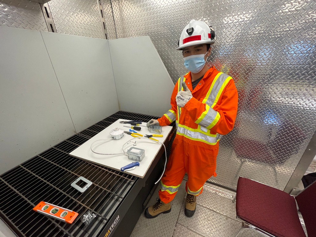 Industrial electrical apprentice completing a residential wiring exercise
