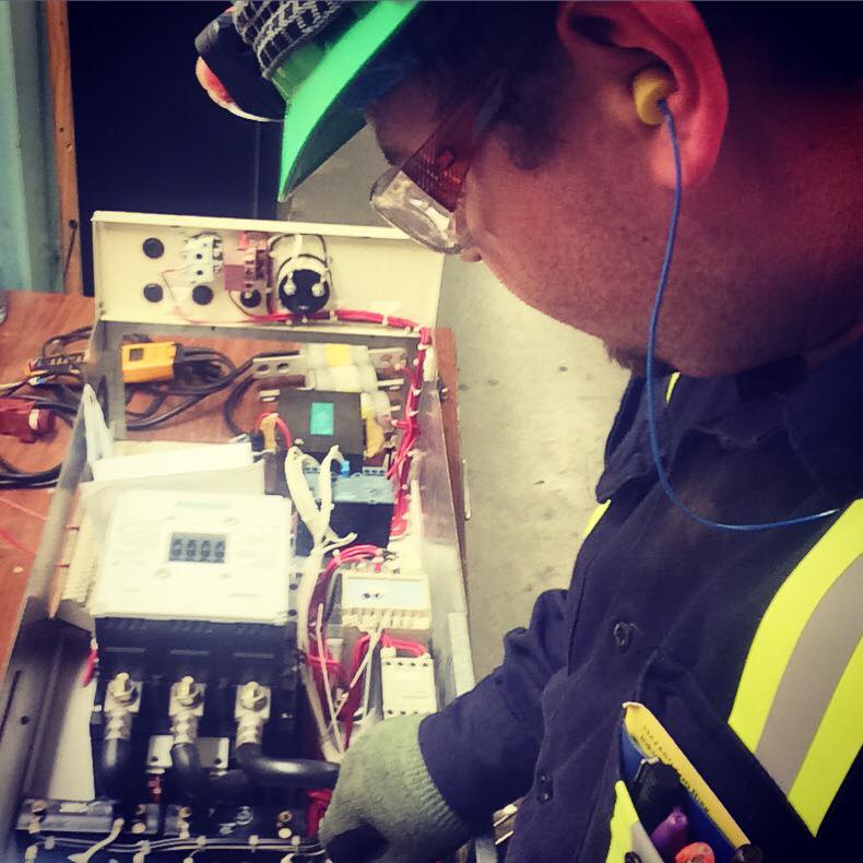Shawn working on an electrical starter in a mill